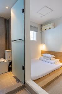 Postel nebo postele na pokoji v ubytování Pipe Hostel Myeongdong