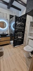 a bathroom with a shower and a toilet in a room at Chic & Design Studio for 3 people in Thonon-les-Bains