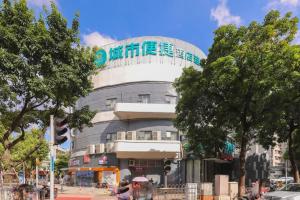 a building with a sign on the top of it at City Comfort Inn Zhongshan Lihe Square Walmart Branch in Zhongshan