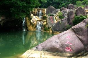 a waterfall in front of a pool of water at Lavande Hotels Jingshan Bus Station in Jingshan