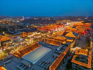 an overhead view of a city at night at Xi'an Jinshengdi Hotel, Datang Everbright City, Big Wild Goose Pagoda Branch in Xi'an