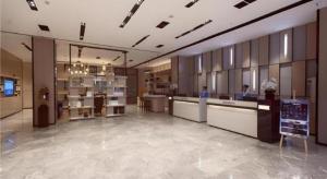 a lobby of a store with people in a room at Echarm Hotel Yiyang Wanda Plaza in Heshanqu