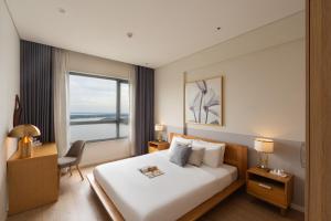 Ένα ή περισσότερα κρεβάτια σε δωμάτιο στο Diamond Island Highfloor RiverView 8min to D1 +79 φωτογραφίες