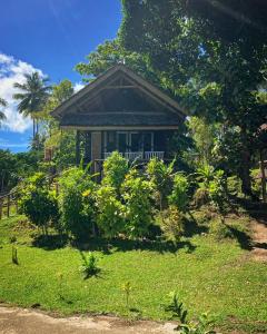 a small house in the middle of a yard at Pristine Paradise Dive Resort - Togean Islands, Una Una in Pulau Unauna