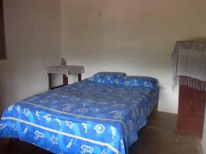 Postel nebo postele na pokoji v ubytování El Garaje Hostal