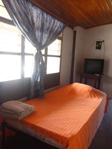 Postel nebo postele na pokoji v ubytování El Garaje Hostal