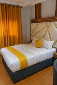 Postel nebo postele na pokoji v ubytování Hôtel Foham Oasis