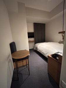 Postel nebo postele na pokoji v ubytování Hotel Resol Stay Akihabara