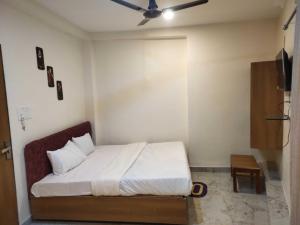 Postel nebo postele na pokoji v ubytování Hotel O Eleven