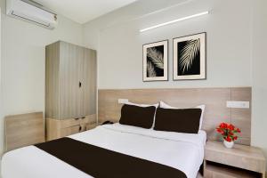Postel nebo postele na pokoji v ubytování Super Hotel O KSR Bengaluru City Junction Formerly Gurudev Residency + 22 fotografií