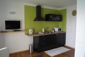 a kitchen with a sink and a microwave at Loma Dos, Arguineguin in La Playa de Arguineguín