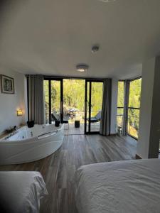 Postel nebo postele na pokoji v ubytování Xaxa Lodge