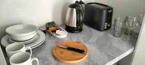 Příslušenství pro přípravu čaje a kávy v ubytování Mural