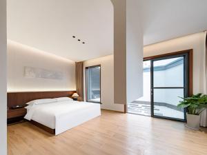 Imagen de la galería de Floral Shemanyue Mountain Homestay, en Tangkou