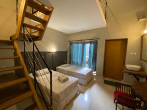 Postel nebo postele na pokoji v ubytování JH Hotel