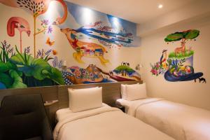 Säng eller sängar i ett rum på Legend Hotel Kaohsiung Pier2