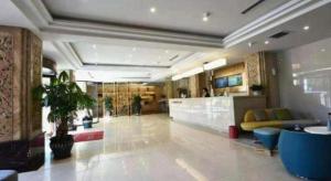 a lobby of a building with a lobby at GreenTree Inn Chengde Shuangyu District Shuangtashan in Chengde