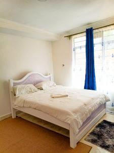 Postel nebo postele na pokoji v ubytování Camp Flo Eldoret -Homely Comfort in a Private Compound