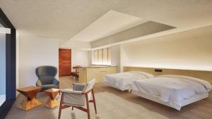 Postel nebo postele na pokoji v ubytování 嬉野温泉 枯淡嬉野