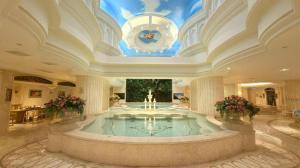 a large room with a large fountain in a building at Lake Piedmont International Hotel in Guangzhou
