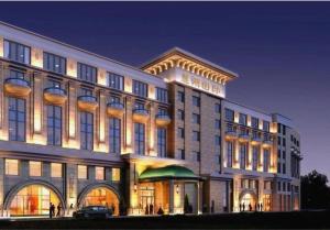a large building with a car parked in front of it at Lake Piedmont International Hotel in Guangzhou