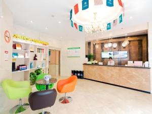 a waiting room with colorful chairs and a counter at GreenTree Inn Shanghai Guangxin Road Tongji Hospital Express Hotel in Shanghai