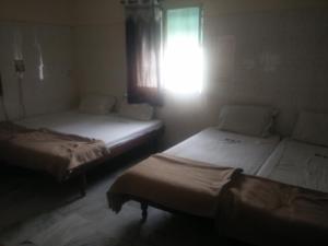 Postel nebo postele na pokoji v ubytování MSR Lodge
