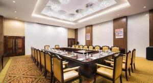 a large conference room with a long table and chairs at Lhasa Hotel in Lhasa