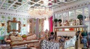 a large living room with a chandelier and furniture at Kamiseta Hotel in Camp John Hay