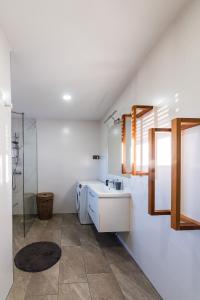 a bathroom with a sink and a shower at Apartma Ksela in Mala Nedelja