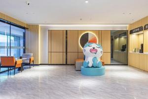 a lobby with a bunny statue in the middle of it at City Comfort Inn Wuhan Hankou Railway Station West Square in Wuhan