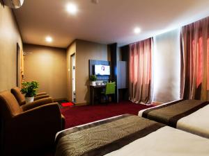 Postel nebo postele na pokoji v ubytování LS Hotel