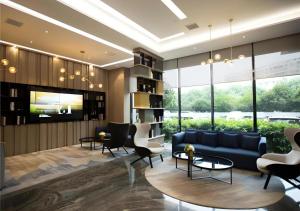 a living room with a blue couch and chairs at City Comfort Inn Wuhan Huangpu in Wuhan