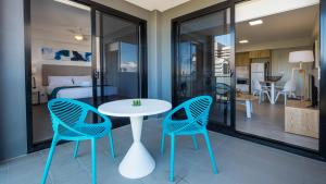 a dining room table and chairs in a room at Annexe Apartments in Brisbane