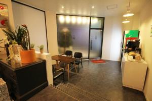 an office space with a table and a dining room at Hotel Yam ANDONG in Andong