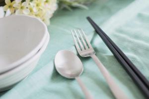 a table with a fork and a spoon on a table at b hotel Miyajima Omotesando - Sacred Island Stay 21 in Miyajima +19 photos