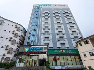 a tall building with a sign in front of it at City Comfort Inn Beihai Hepu Bus Terminal in Hepu