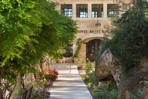 a building with a sign that reads hotel bat preserve at Herbert Samuel Bayit Bagalil Boutique in Hatzor haglilit