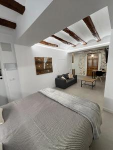 Giường trong phòng chung tại Les Cases de Laia