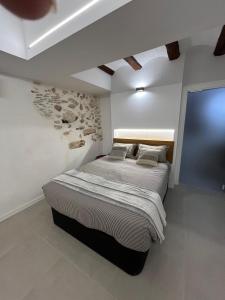 Giường trong phòng chung tại Les Cases de Laia