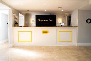 a room with a white counter with a sign on it at Rodeway Inn Near Ybor City - Casino in Tampa