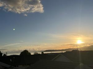 a view of the sunset from the roof of a house at Mountain View Motel in Taupo