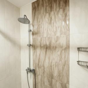 a shower with a glass door in a bathroom at RR Boutique Hotel in Yerevan