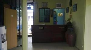 a lobby with a counter and a vase in a room at Mawanza Hotel Langkawi in Langkawi Islands