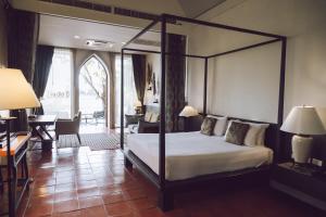 Ένα ή περισσότερα κρεβάτια σε δωμάτιο στο iuDia Hotel