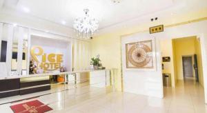 a large lobby with aope hotel sign and a chandelier at Pice Hotel in Kampong Permatang Batu