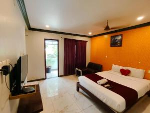 Μια τηλεόραση ή/και κέντρο ψυχαγωγίας στο Sunrise Beach Resort