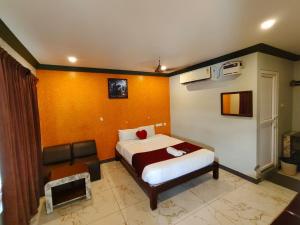 Ένα ή περισσότερα κρεβάτια σε δωμάτιο στο Sunrise Beach Resort