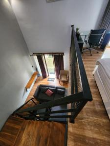 a staircase in a house with a living room at Nana's Villa Sanur in Sanur