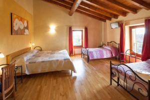 Postel nebo postele na pokoji v ubytování Hotel Alla Corte dei Bicchi